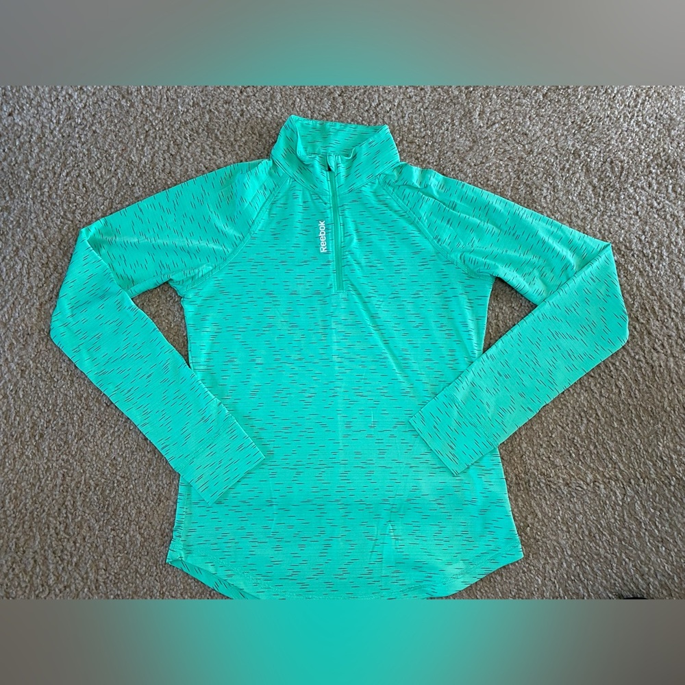 Reebok Woman’s half zip pull over